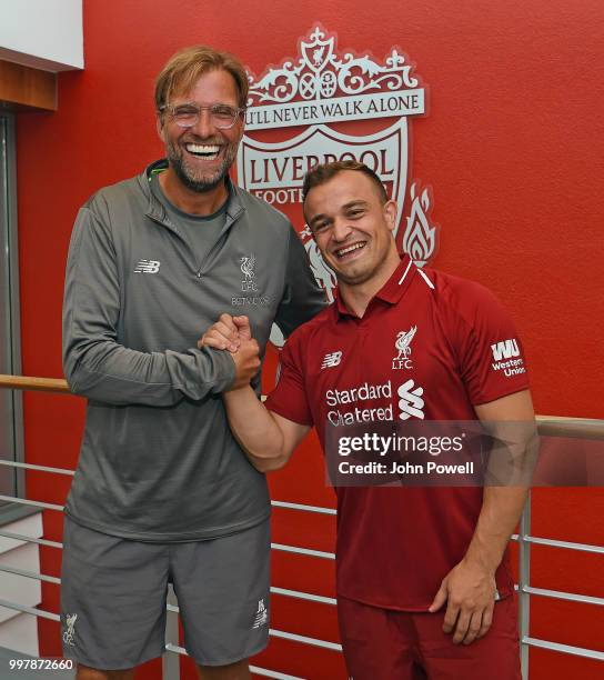 Xherdan Shaqiri with his new boss Jurgen Klopp manager of Liverpool signs for Liverpool at Melwood Training Ground on July 13, 2018 in Liverpool,...