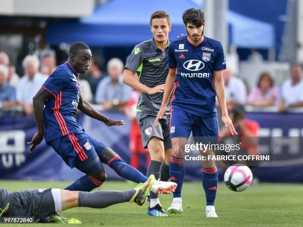 Lyon's French defender Ferland Mendy reacts before scoring his team's second goal in front of his teammate, French forward Martin Terrier during the...