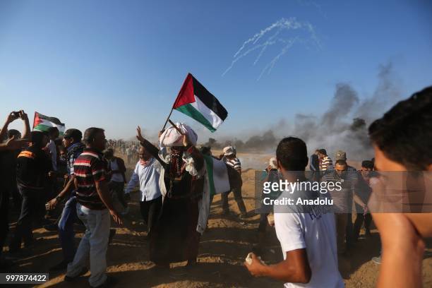 Palestinian demonstrators taking part in the "Great March of Return" demonstration with ''Fidelity to Khan Al-Ahmar'' near Israel-Gaza border in Khan...