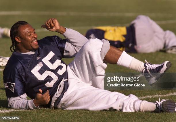 New England Patriots player Willie McGinest stretches at Patriots practice in Foxborough, MA on Dec. 5, 2001. McGinest was unable to play the week...