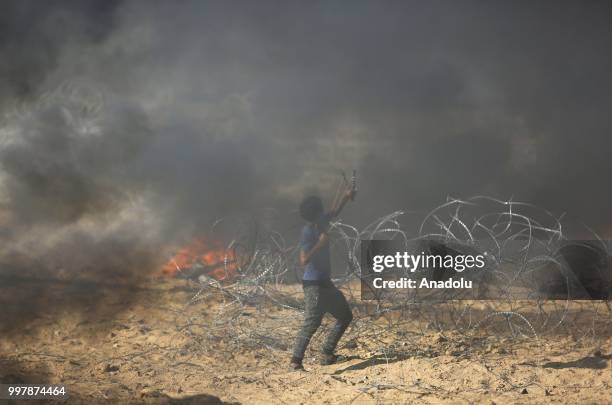 Palestinian demonstrators taking part in the "Great March of Return" demonstration with ''Fidelity to Khan Al-Ahmar'' near Israel-Gaza border in Khan...