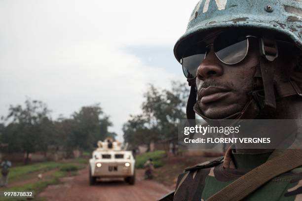 Tanzanian soldier from the UN peacekeeping mission in the Central African Republic , patrols the town of Gamboula, threatened by the Siriri group, on...