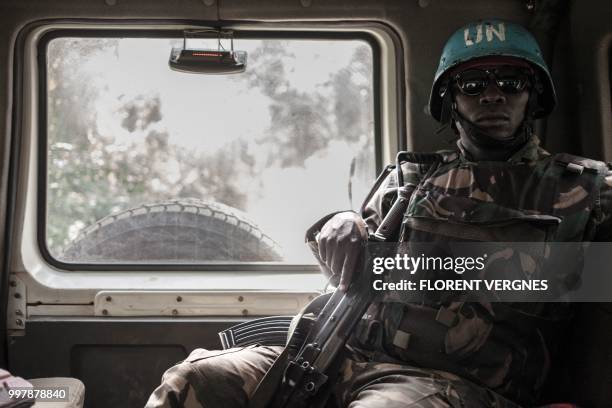 Tanzanian soldier from the UN peacekeeping mission in the Central African Republic , patrols the town of Gamboula, threatened by the Siriri group, on...