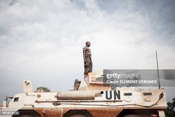 Tanzanian soldier from the UN peacekeeping mission in the Central African Republic , patrols the town of Gamboula, threatened by the Siriri group, on...