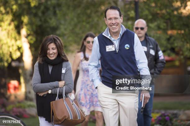 Randall Stephenson, chairman and chief executive officer of AT&T Inc., right, arrives for a morning session at the Allen & Co. Media and Technology...