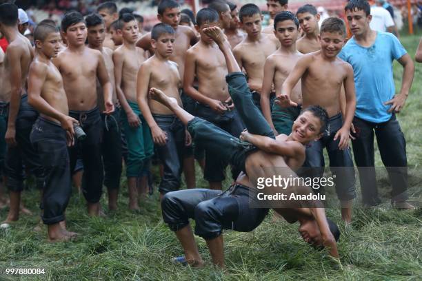 Child wrestlers compete against each other on the first day of the 657th annual Kirkpinar Oil Wrestling Festival in Sarayici near Edirne, Turkey on...