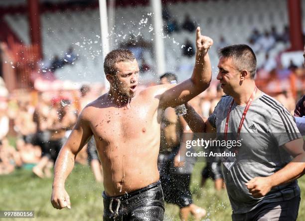 Wrestler celebrates after winning against his opponent on the first day of the 657th annual Kirkpinar Oil Wrestling Festival in Sarayici near Edirne,...