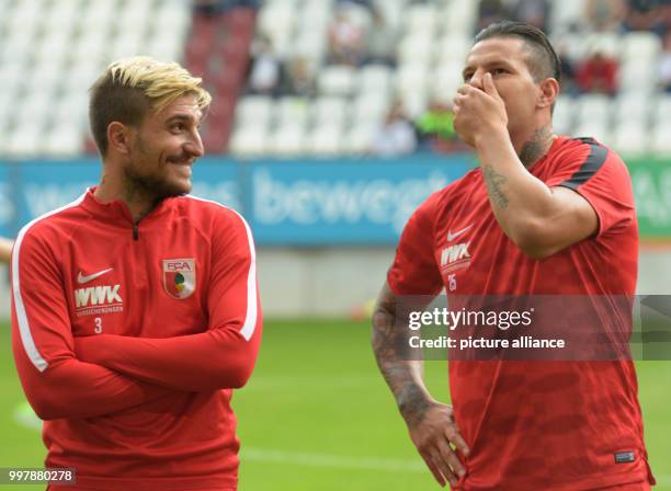 Augsburg's Konstantinos Stafylidis and Raul Bobadilla during the football friendly match between FC Augsburg and PSV Eindhoven at the WWK Arena in...