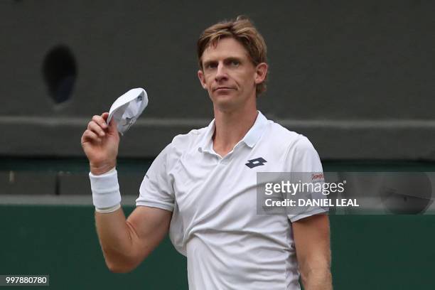 South Africa's Kevin Anderson reacts after winning against US player John Isner during the final set tie-break of their men's singles semi-final...