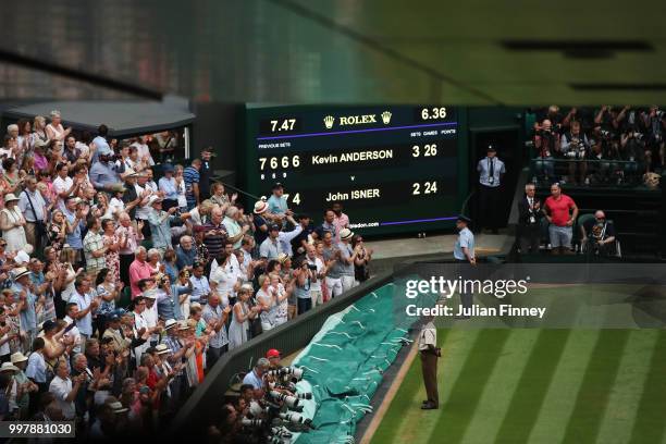 View of the scoreboard after the Men's Singles semi-final match between John Isner of The United States and Kevin Anderson of South Africa on day...