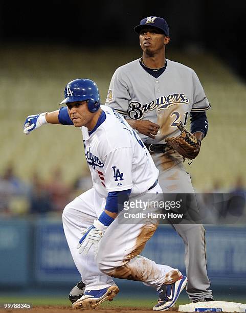 Alcides Escobar of the Milwaukee Brewers and Russell Martin of the Los Angeles Dodgers watch a double play at Dodger Stadium on May 5, 2010 in Los...
