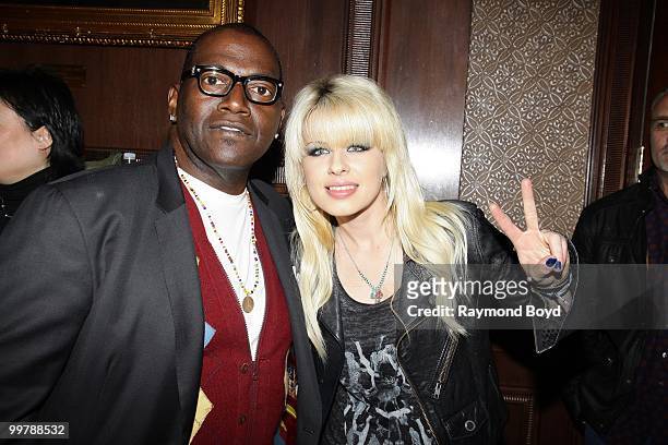 "American Idol" judge and music producer Randy Jackson and singer Orianthi poses for photos in the "Universal Music Suite" at the Hilton Chicago...