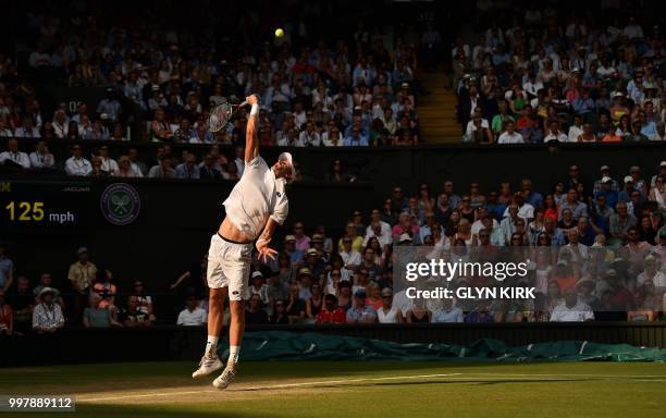 South Africa's Kevin Anderson serves against US player John Isner during the final set tie-break of their men's singles semi-final match on the...