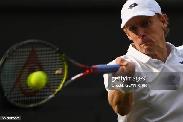 South Africa's Kevin Anderson returns against US player John Isner during the final set tie-break of their men's singles semi-final match on the...