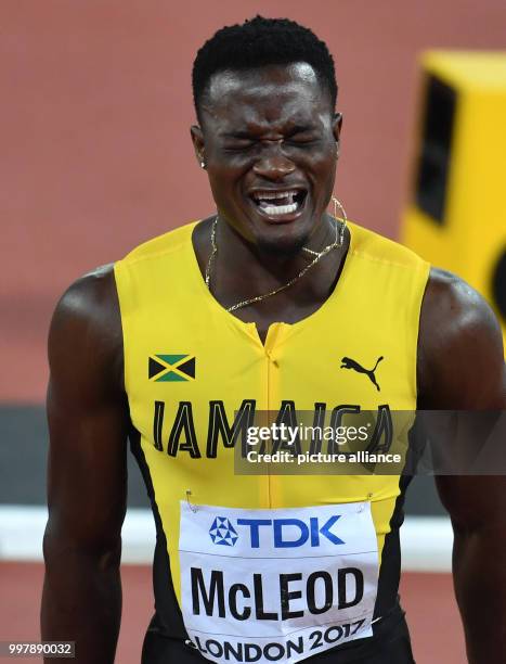 Jamaican athlete Omar McLeod celebrates his victory in the 110 metre men's hurdle jump event at the IAAF London 2017 World Athletics Championships in...