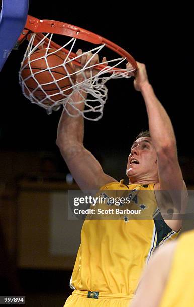 Ben Knight of Australia dunks during the Australia v Brazil match in the Mens Basketball held at the Brisbane Convention and Exhibition Centre at the...