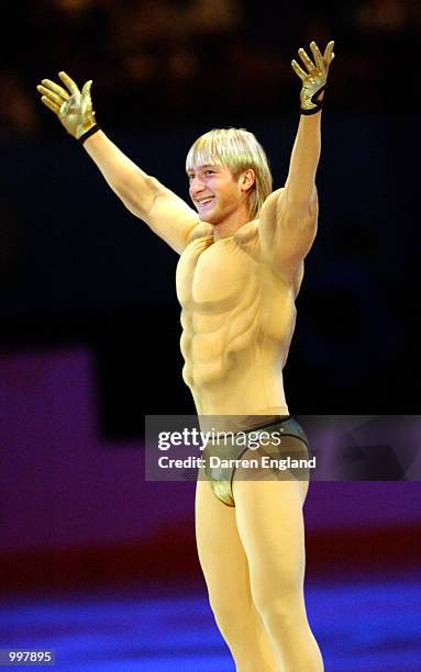 Evgeni Plushenko of Russia shows off to the crowd while performing wearing a muscle man costume at the Exhibition of Champions Figure Skating...