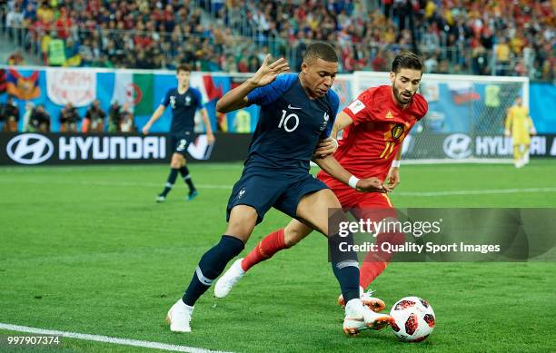 Kylian Mbappe of France competes for the ball with Yannick Carrasco of Belgium during the 2018 FIFA World Cup Russia Semi Final match between Belgium...