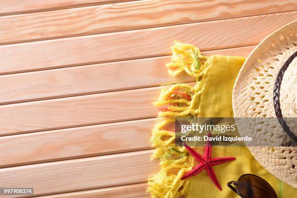 articles of beach on wooden slats top view - hood ornament stock pictures, royalty-free photos & images