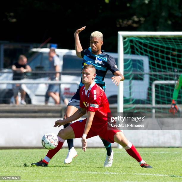 Stanislav Iljutcenko of Duisburg and Fabian Lustenberger of Hertha BSC battle for the ball during the TEDi-Cup match between Hertha BSC and MSV...