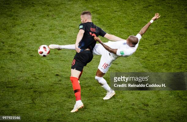 Ante Rebic of Croatia and Ashley Young of England battle for the ball during the 2018 FIFA World Cup Russia Semi Final match between England and...