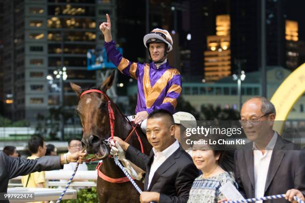 Jockey Zac Purton, trainer Danny Shum Chap-shing and owners celebrate after Charity Wings winning the Race 4 Maverick Star Handicap at Happy Valley...