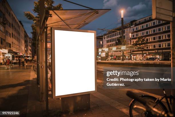 bus stop with blank billboard - bus poster fotografías e imágenes de stock