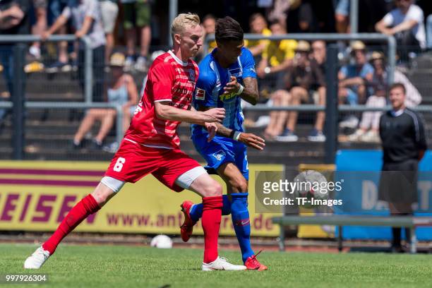 Justin Klein of Westfalia Herne and Davie Selke of Hertha BSC battle for the ball during the TEDi-Cup match between Hertha BSC and Westfalia Herne on...