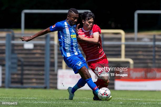 Salomon Kalou of Hertha BSC and Kai Hatano of Westfalia Herne battle for the ball during the TEDi-Cup match between Hertha BSC and Westfalia Herne on...