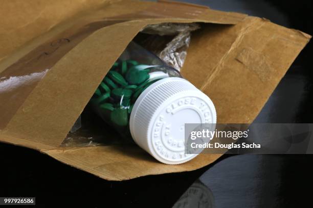 shipping package with home delivery medication - prescription home delivery stock pictures, royalty-free photos & images