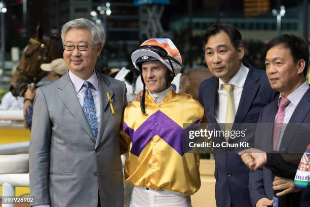 Jockey Zac Purton, trainer Michael Chang Chun-wai and owners celebrate after Saul's Special winning the Race 6 Let Me Fight Handicap at Happy Valley...