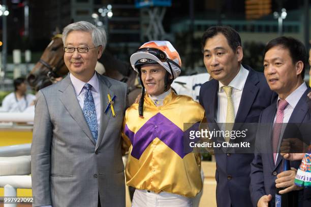 Jockey Zac Purton, trainer Michael Chang Chun-wai and owners celebrate after Saul's Special winning the Race 6 Let Me Fight Handicap at Happy Valley...