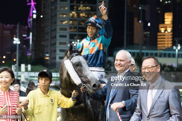 Jockey Vincent Ho Chak-yiu, trainer David Hall and owners celebrate after Super Turbo winning the Race 7 Sun Jewellery Handicap at Happy Valley...