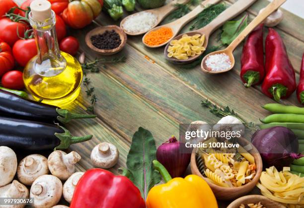 variety of vegetables on wooden background. - red bell pepper stock pictures, royalty-free photos & images