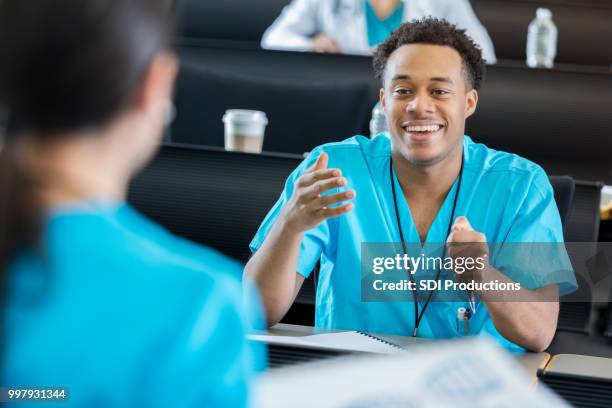 male nursing student asks question - east slavic people stock pictures, royalty-free photos & images