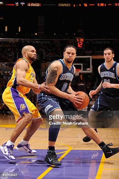 Deron Williams of the Utah Jazz posts up against Derek Fisher of the Los Angeles Lakers in Game Two of the Western Conference Semifinals during the...
