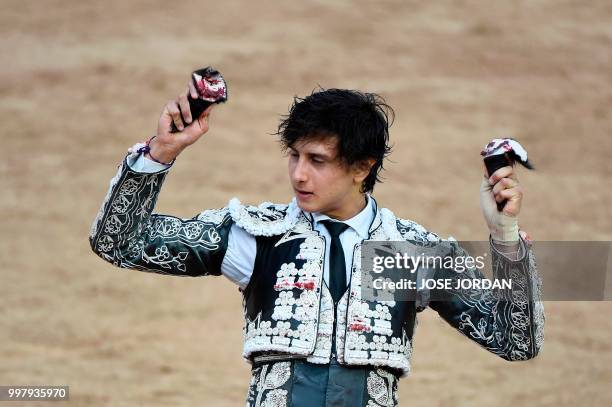 Spanish matador Andres Roca Rey celebrates cutting the ears of a Jandilla fighting bull during a bullfight of the San Fermin festival in Pamplona,...