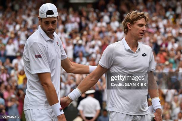 South Africa's Kevin Anderson shakes hands after winning against US player John Isner during the final set tie-break of their men's singles...