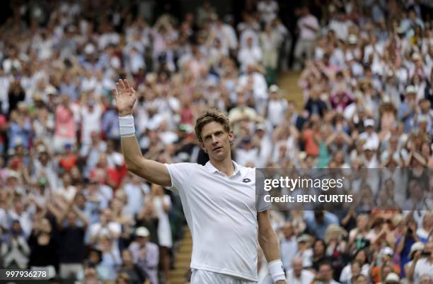 Spectators applaud after South Africa's Kevin Anderson won against US player John Isner during the final set tie-break of their men's singles...