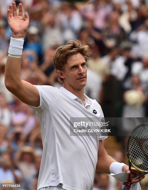 South Africa's Kevin Anderson celebrates after winning against US player John Isner during the final set tie-break of their men's singles semi-final...