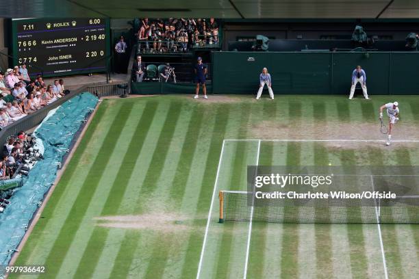 Mens Singles, Semi-Final - Kevin Anderson v John Isner - Kevin Anderson serves as the curtsied clock shows 6 hours have passed during this match at...