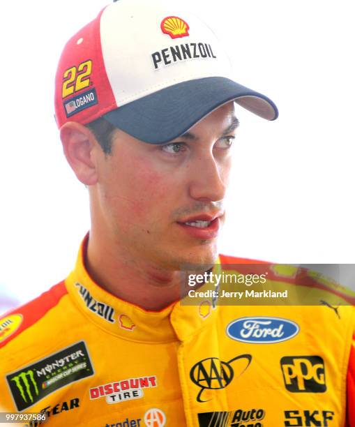 Joey Logano, driver of the Shell Pennzoil Ford, stands in the garage area during practice for the Monster Energy NASCAR Cup Series Quaker State 400...