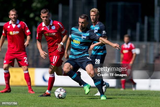 Stanislav Iljutcenko of Duisburg and Vedad Ibisevic of Hertha BSC battle for the ball during the TEDi-Cup match between Hertha BSC and MSV Duisburg...