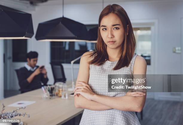 women standing angry with laziness coworker at office - selfishness stock pictures, royalty-free photos & images