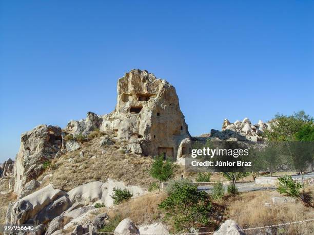 volcanic cliffs and rock formations at cappadocia - rock hoodoo stockfoto's en -beelden