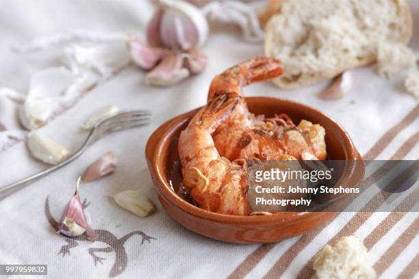 spanish style garlic prawns - stephens stock pictures, royalty-free photos & images