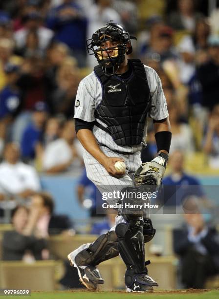 Miguel Olivo of the Colorado Rockies reacts to a run scored by the Los Angeles Dodgers at Dodger Stadium on May 7, 2010 in Los Angeles, California.