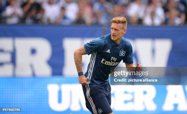 Hamburg's André Hahn stands on the pitch during the friendly match between Hamburger SV and Espanyol Barcelona in the Volkspark Stadium in Hamburg,...