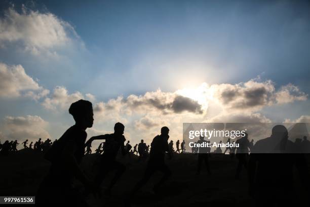 Palestinian demonstrators take part in the "Great March of Return" demonstration with ''Fidelity to Khan Al-Ahmar'' near Israel-Gaza border at...