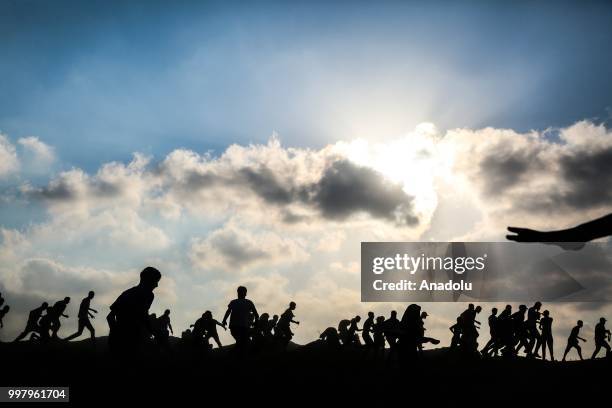 Palestinian demonstrators take part in the "Great March of Return" demonstration with ''Fidelity to Khan Al-Ahmar'' near Israel-Gaza border at...